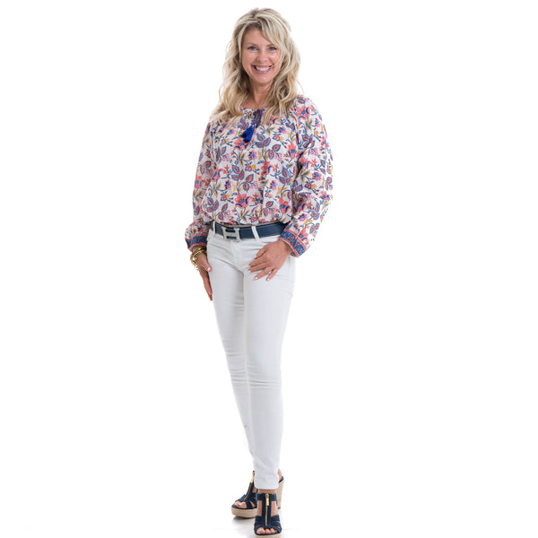 Floral block printed soft cotton full sleeve top with a navy tassel detail .