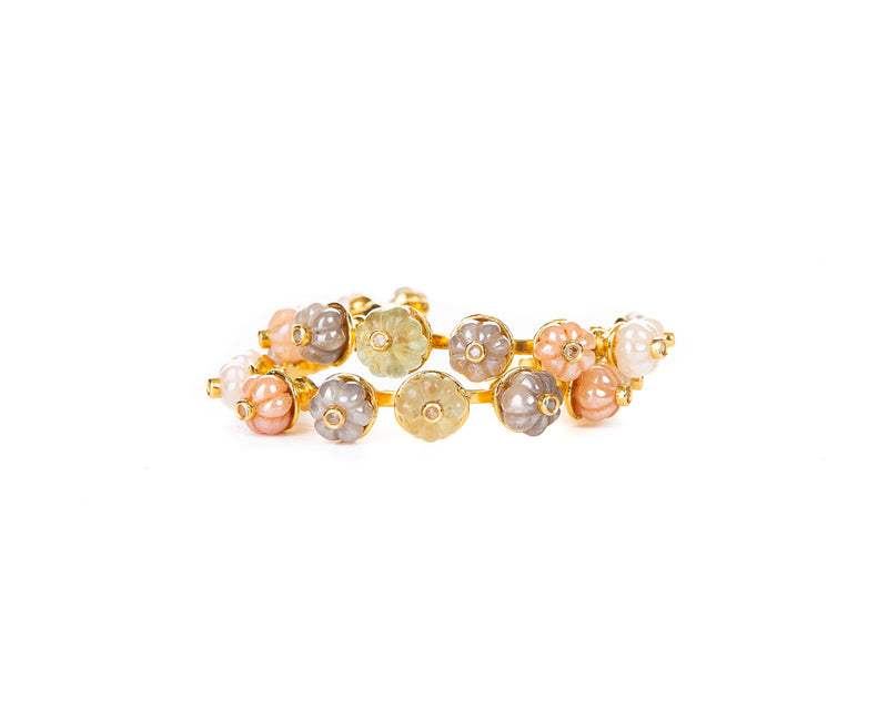 This cuff with 18K gold plating finish is the ideal accessory to a daytime outfit, thanks to its side opening it is easy to put on and take off. Its all-around stones features stones in a traditional watermelon cut and a vivid splash of rainbow colors which will compliment any outfit.  Foundational for any stack and eminently wearable, this is a staple that will accompany you for the rest of your life.