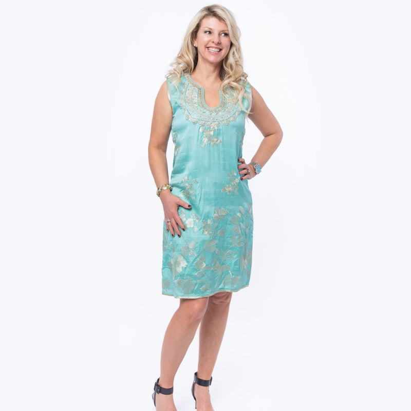 Sleeveless dress in turquoise silk brocade with embroidery detail around neckline and the back of the dress.