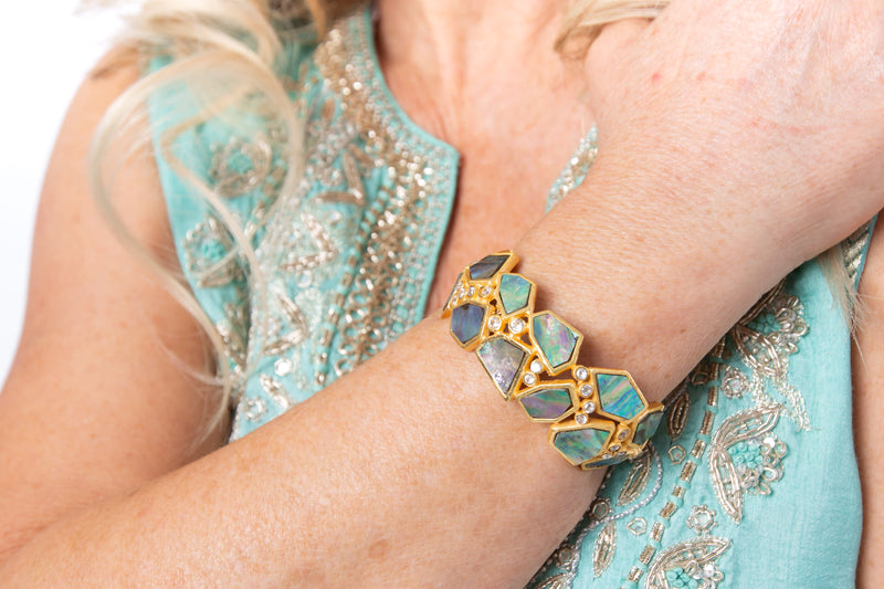 Sleeveless dress in turquoise silk brocade with embroidery detail around neckline and the back of the dress.