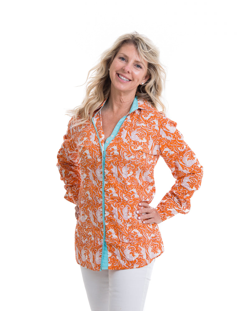 Hand block printed cotton shirt in orange with turquoise trim. Embroidery detail in the back of the shirt.