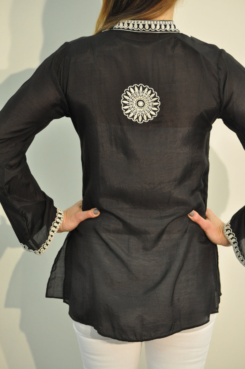 Black cotton silk tunic with extensive white beading and embroidery around the neck, sleeves and back of the tunic. 