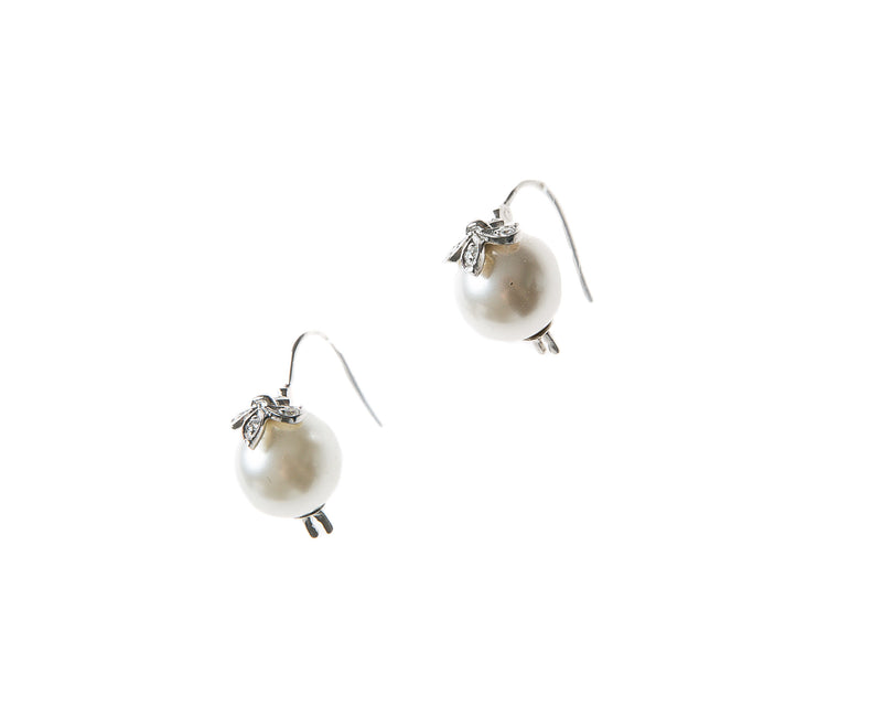 White Pearl and Sterling Silver Drop Earring with Fleur-de-lis detail in sterling silver and Swarovski crystal on pearl. 