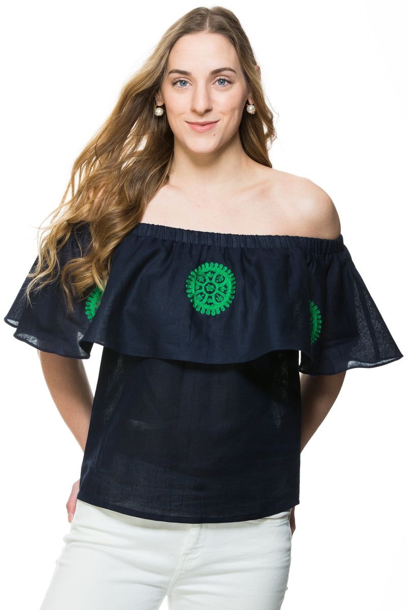 Navy Linen top with green embroidery detail. This top can be worn of the shoulders or as a scoop neck. It has a frill detail around the neckline.