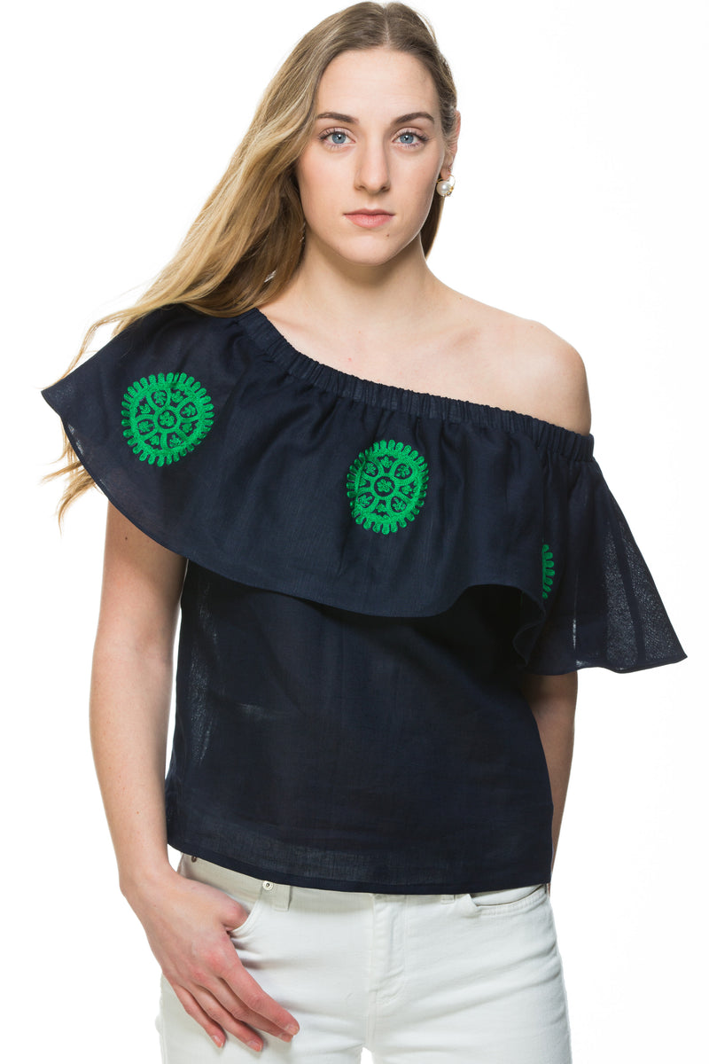 Navy Linen top with green embroidery detail. This top can be worn of the shoulders or as a scoop neck. It has a frill detail around the neckline.