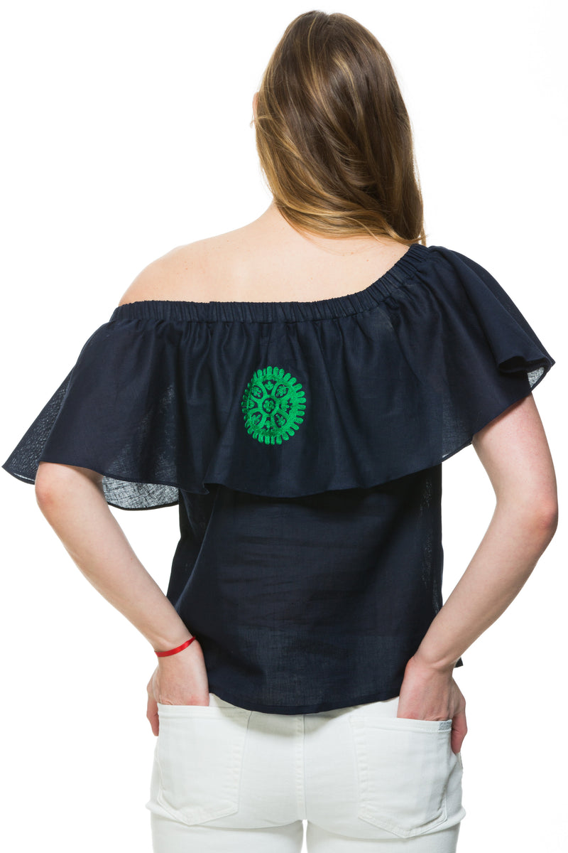 Navy Linen top with green embroidery detail. This top can be worn of the shoulders or as a scoop neck. It has a frill detail around the neckline.