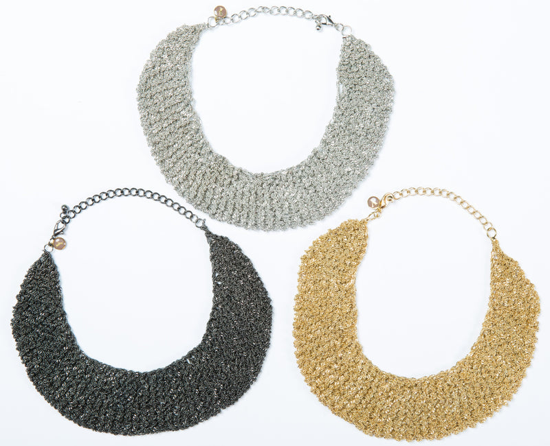 The Ella mesh necklace is hand crocheted and can be worn as a choler. It comes in 3 finishes, gold, white gold and black. 