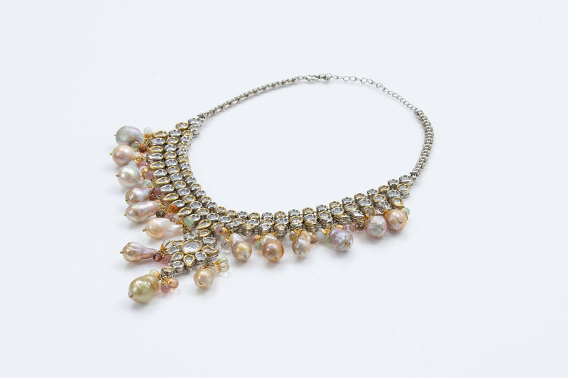 The Jaipur necklace is a take on the traditional uncut diamond necklace. The crystals and pearls are reminiscent of royal Indian jewelry also refereed to as jadua jewelry. 