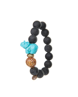 The JOY Bracelets are a must have for all Elephant enthusiasts. Its organic silhouette is crafted by hand. It is hand-strung lava stone bead after bead with flowing fluidity as an easy to wear stretch bracelet to create a sinuous, harmonious whole.  It is the ideal accessory and thanks to its stretchy nature the bracelet is easy to put on and take off. It’s all round stones with the organic natural stone ridges connect you to the earth.