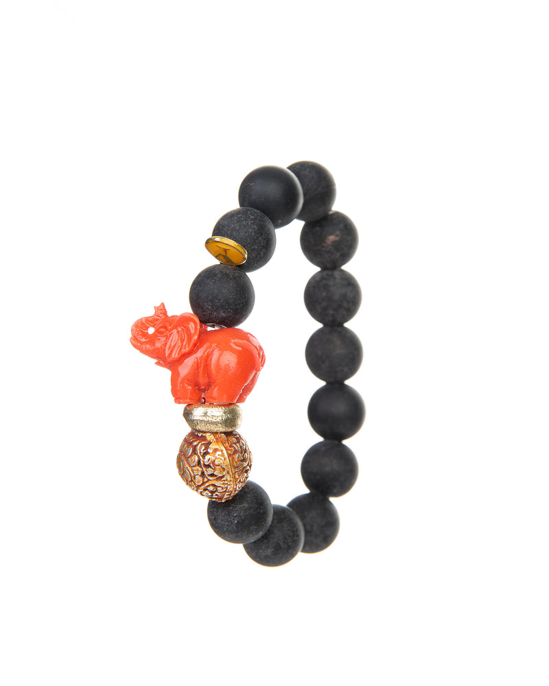 The JOY Bracelets are a must have for all Elephant enthusiasts. Its organic silhouette is crafted by hand. It is hand-strung lava stone bead after bead with flowing fluidity as an easy to wear stretch bracelet to create a sinuous, harmonious whole.  It is the ideal accessory and thanks to its stretchy nature the bracelet is easy to put on and take off. It’s all round stones with the organic natural stone ridges connect you to the earth.