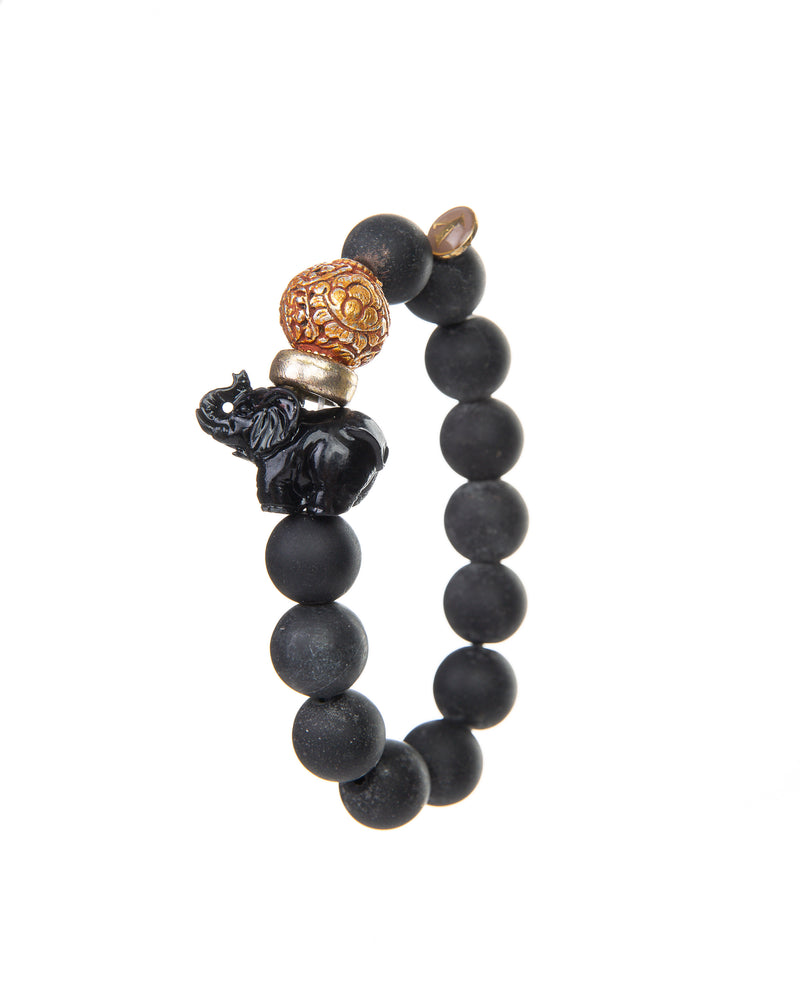 The JOY Bracelets are a must have for all Elephant enthusiasts. Its organic silhouette is crafted by hand. It is hand-strung lava stone bead after bead with flowing fluidity as an easy to wear stretch bracelet to create a sinuous, harmonious whole.  It is the ideal accessory and thanks to its stretchy nature the bracelet is easy to put on and take off. It’s all round stones with the organic natural stone ridges connect you to the earth.