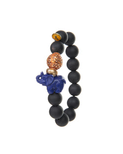 The JOY Bracelets are a must have for all Elephant enthusiasts. Its organic silhouette is crafted by hand. It is hand-strung lava stone bead after bead with flowing fluidity as an easy to wear stretch bracelet to create a sinuous, harmonious whole.  It is the ideal accessory and thanks to its stretchy nature the bracelet is easy to put on and take off. It’s all round stones with the organic natural stone ridges connect you to the earth.