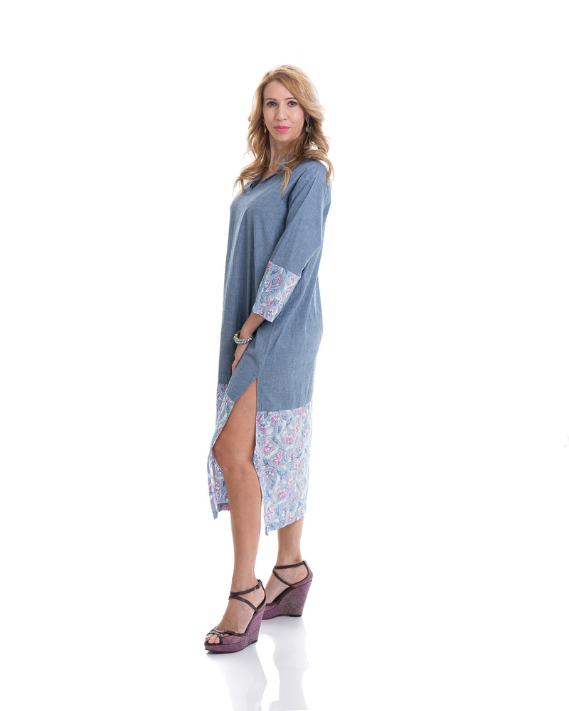 The image shows the Yatra Hope Kaftan Dress. The material is 100% chambray cotton with floral block printed detail at the sleeves and the boson half of the kaftan. 