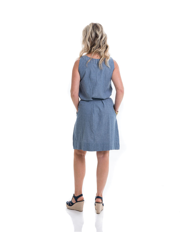 The Isabel dress in chambray is a comfortable everyday sleeveless dress with a tassel belt that helps define the waist.