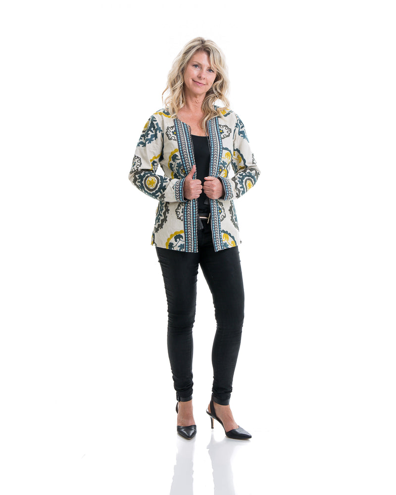 Hip length cotton jacket with extensive embroidery in various colors. The jacket is lined and has tassels enclosures. 