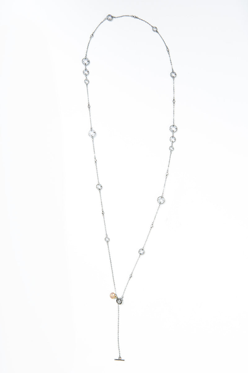 Delicate necklace with varied sizes of Swarovski crystals. Length of necklace is 40". This necklace can be worn long or doubled. The toggle clasp makes it easier to wear and take off. 