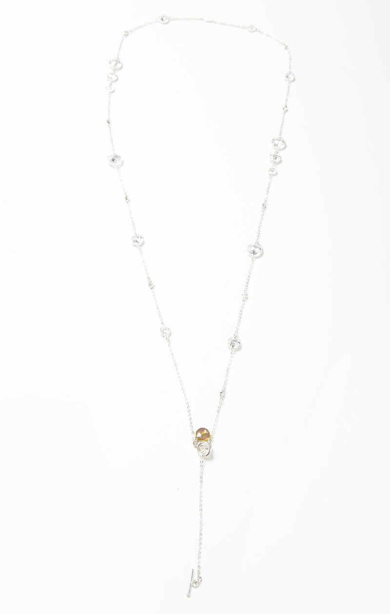 Delicate necklace with varied sizes of Swarovski crystals. Length of necklace is 40". This necklace can be worn long or doubled. The toggle clasp makes it easier to wear and take off. 