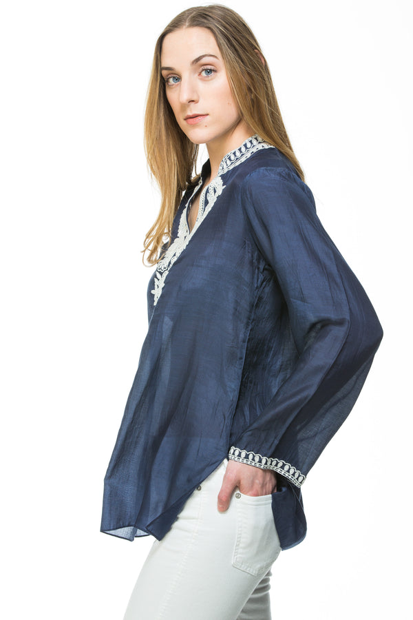 Navy blue cotton silk tunic with extensive white beading and embroidery around the neck, sleeves and back of the tunic. 