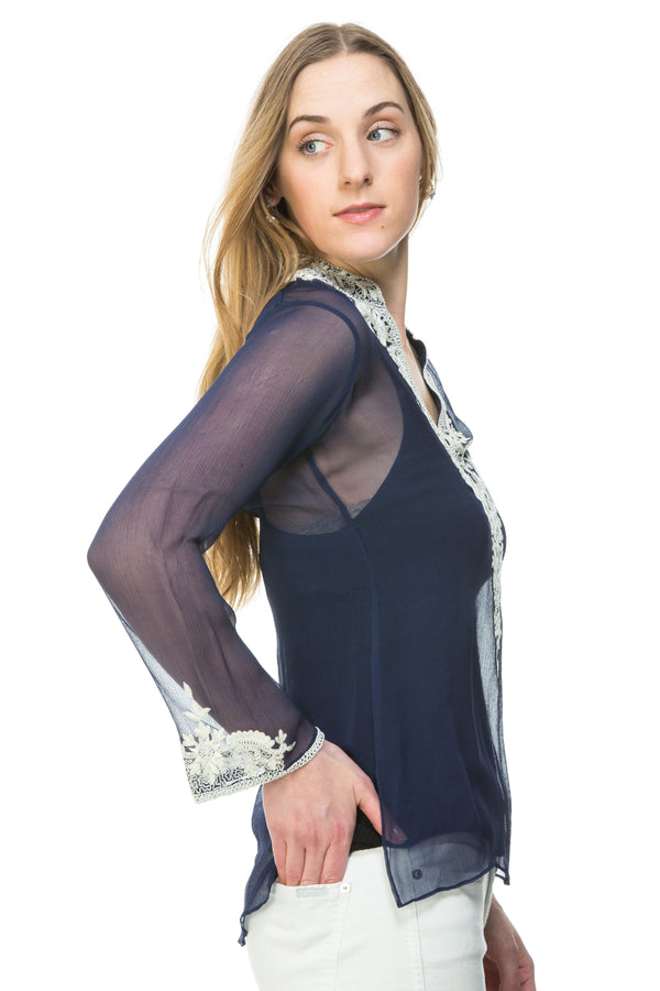 Silk chiffon tunic available in navy with white silk thread and bead embroidery and nude with black silk thread and bead embroidery. Embroidery detail around the neck and sleeves of the tunic. This is a sheer tunic. 