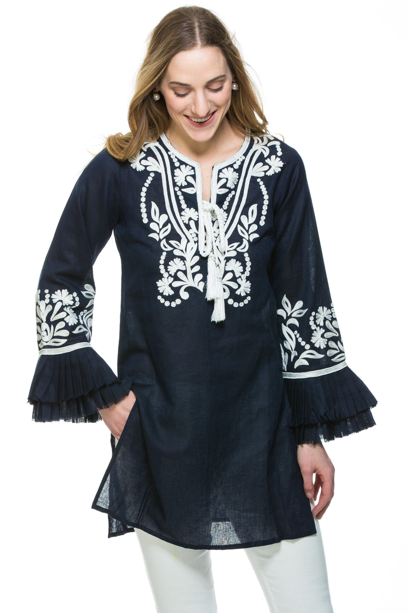 Dressy linen tunic with substantial embroidery detail. The tunic has unique pleated, layered sleeves that are a work of art. Tunic is available in 3 different colors. All tunics have white embroidery details. 