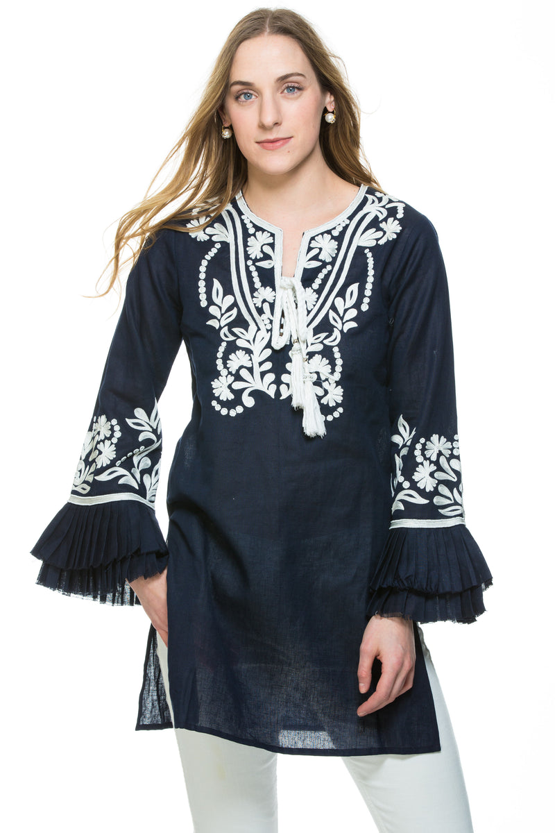 Dressy linen tunic with substantial embroidery detail. The tunic has unique pleated, layered sleeves that are a work of art. Tunic is available in 3 different colors. All tunics have white embroidery details. 