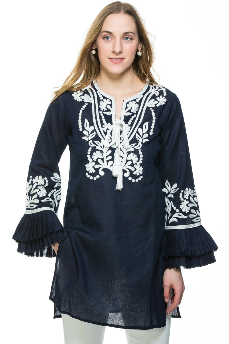 Dressy linen tunic with substantial embroidery detail. The tunic has unique pleated, layered sleeves that are a work of art. Tunic is available in 3 different colors. All tunics have white embroidery details. 