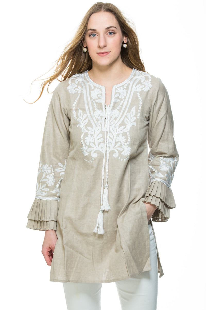 Dressy linen tunic with substantial embroidery detail. The tunic has unique pleated, layered sleeves that are a work of art. Tunic is available in 3 different colors. All tunics have white embroidery details. 