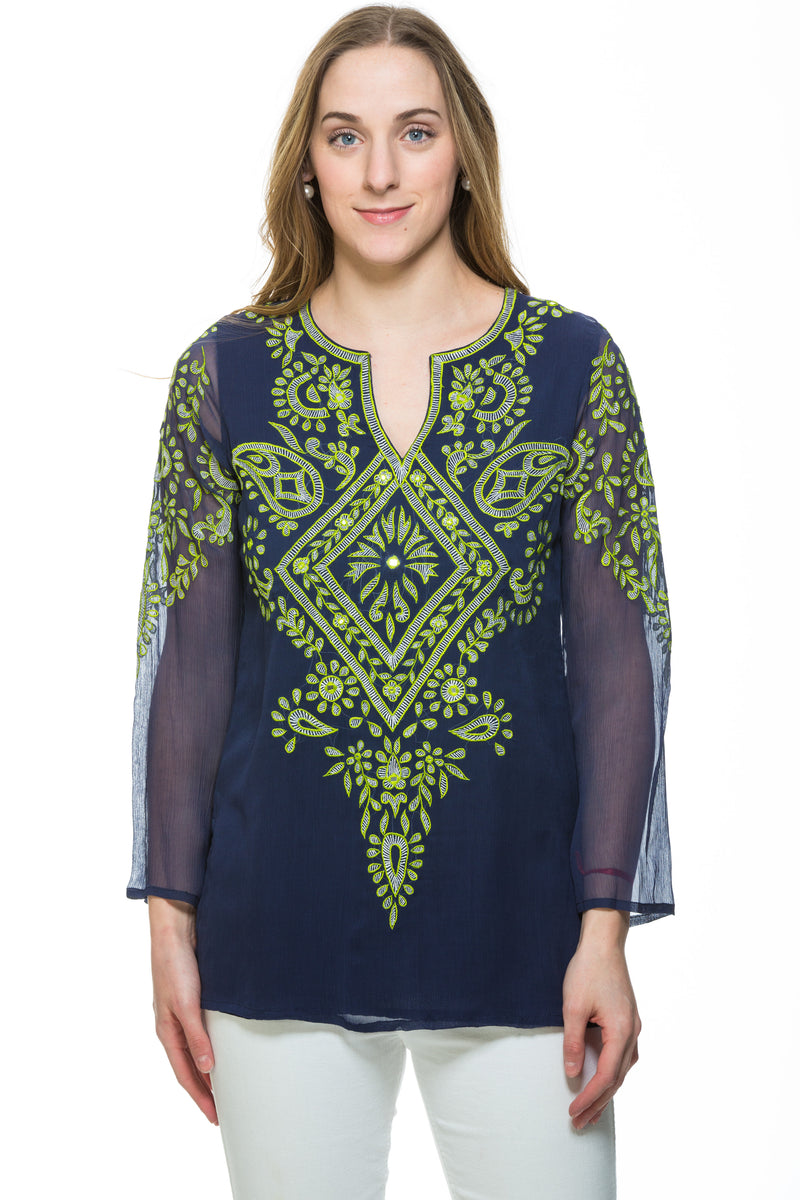 This silk chiffon navy tunic has extensive green embroidery along the front and sleeves of the garment. There is a motif at the back of the tunic as well. The sleeves of the tunic are sheer but the rest of the tunic is lined. 
