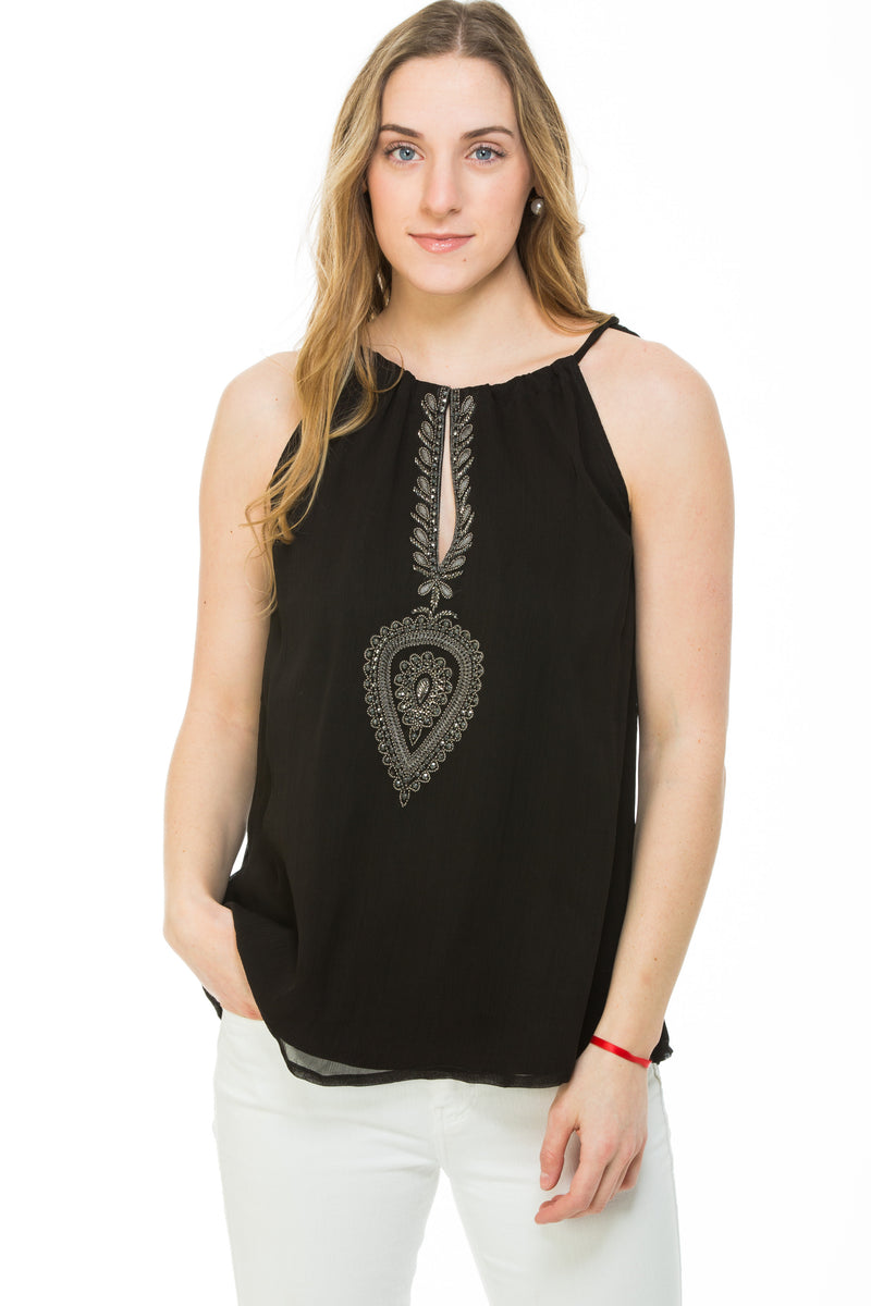 The Ibiza top is a lined chiffon top with a halter neckline. The top is available in black, red, white, gray and navy.